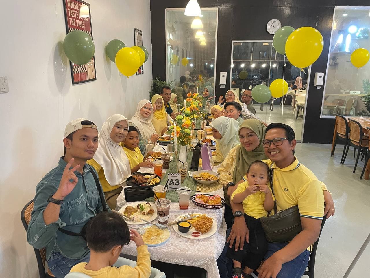 A family celebration around a full table at The Roadside Eatery